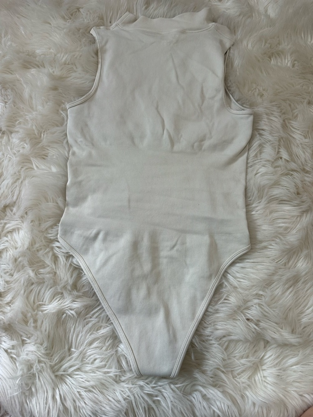 Sleeveless Ribbed High-Neck Cream Bodysuit